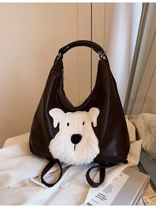 Brown leather tote bag with a cute white fuzzy puppy patchwork and top zipper handle
