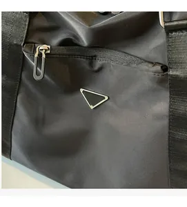 Detail of durable black nylon travel bag featuring metal zipper and sleek woven texture