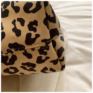 Detail shot of leopard print tote bag with premium stitching and suede texture