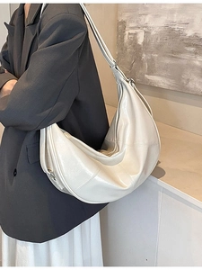 Versatile cream faux leather crescent backpack and crossbody bag with polished finish