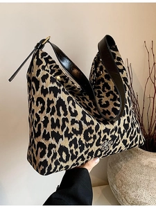 Large leopard jacquard bucket bag with black leather strap and metal logo buckle