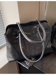 Retro charcoal grey leather tote bag with vintage texture and gold buckle detail