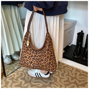 Detailed leopard print hobo shoulder bag with leather handle and round bead charm accent