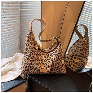 Detailed leopard print hobo bag with leather strap and MYBAGB lettering on mirror background