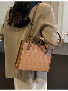 Women's brown patchwork tote bag with geometric woven texture and shoulder strap