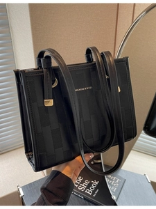 Chic black woven leather tote bag with dual shoulder straps for work and daily use