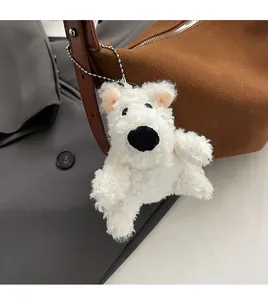 Cute white fluffy bear plush pendant with silver bead chain attached to a brown suede bag