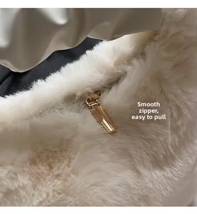 Detailed close-up of premium gold metal zipper on luxury cream faux fur plush handbag
