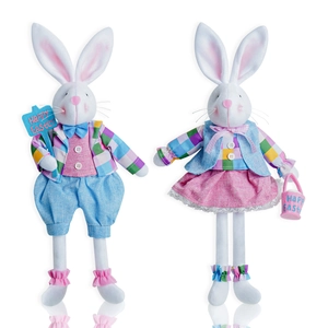 Detail of plush Easter bunny couple figurines in colorful plaid outfits with festive signs