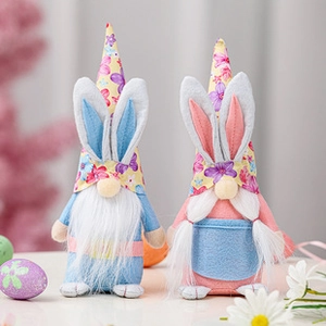 Detail of Easter bunny ear gnome plush toys with floral hats and festive egg decorations