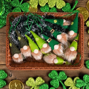 Basket of green St. Patrick's Day gnome ornaments with golden shamrock details