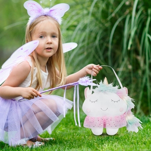 Detail of child fairy costume set with purple wings and unicorn plush basket bag