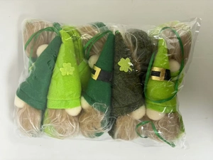 Close-up of St. Patrick's Day green gnome plush ornaments with clover and belt details