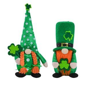 Two St. Patrick's Day green gnomes with orange beard and clovers for home decoration