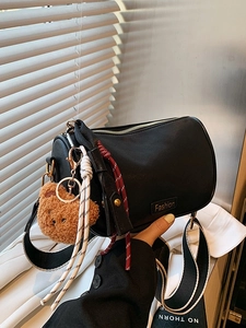 Fashionable black Boston crossbody bag for women with cute bear charm and striped strap