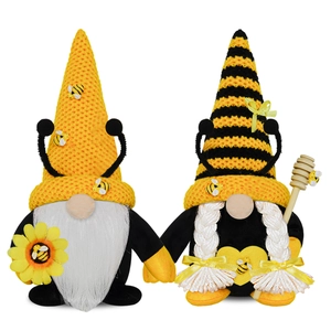Pair of bee festival gnomes with sunflower and honey wand on white background