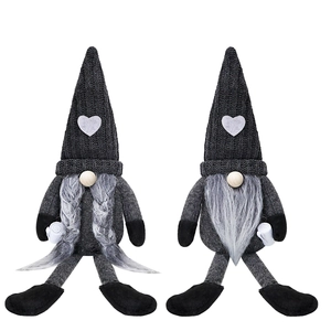 Detail of two handmade coffee gnomes with grey braids and beards in Scandinavian style