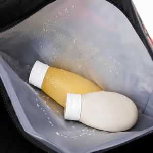 Waterproof frosted travel pouch showing silicone bottles with water droplets for toiletries