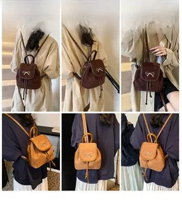 Detailansicht Mini-Eimerrucksack mit silberner Schleife in Dunkelbraun und Camel-Farben