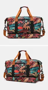 Detail view of leaf print travel bag featuring a reinforced bottom shoe compartment