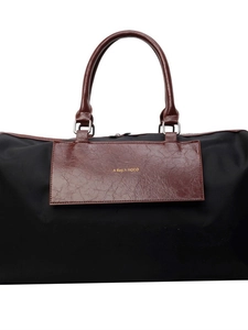 Large capacity black nylon travel bag with brown leather handles and golden logo detail