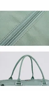 Detail of smooth metal zipper and comfortable woven handles on mint green travel bag