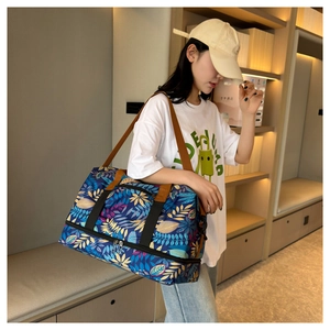 Sac de voyage avec imprimé feuilles tropicales et compartiment à chaussures séparé
