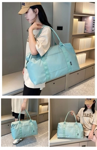 Detail view of a mint blue waterproof travel bag showing large capacity and reinforced handles