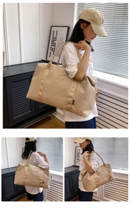 Detail of a beige waterproof nylon travel bag featuring sturdy dual handles and side brand tag