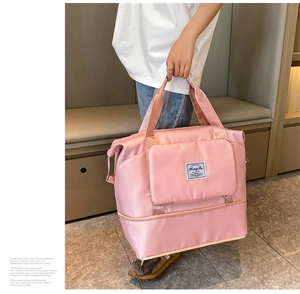Bolso de viaje rosa en tela Oxford con asas reforzadas y bolsillo frontal con cremallera