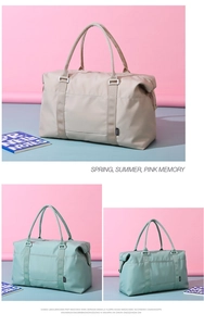 Detail of waterproof nylon travel bag with dual handles and side brand label in soft colors