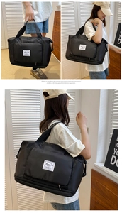 Detail of waterproof nylon travel bag with expandable zipper bottom and durable handles