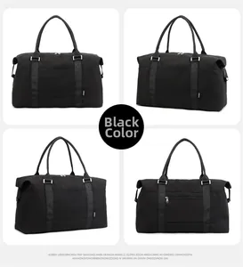 Detail view of the black travel bag showing reinforced handles and side hardware buckles