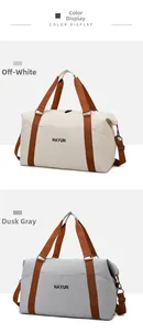 Close-up of HAYUN large travel bags in off-white and gray with durable canvas and brown straps