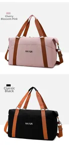 Detail view of large capacity travel bags in Sakura Pink and Versatile Black canvas