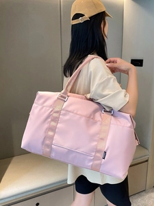Pink waterproof travel bag with large capacity and nylon handles for gym or travel