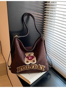 Vintage brown suede tote bag featuring teddy bear embroidery and holiday patch