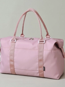 Pink waterproof travel bag with large capacity and shoulder strap for gym or travel
