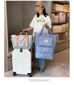 Detail of mint green and blue travel bags with back luggage sleeve for suitcases