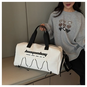 White large capacity sports travel tote bag with black strap and logo shown on model