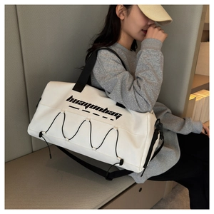 Detail of white waterproof fitness tote bag with crossbody strap and huayunbag logo