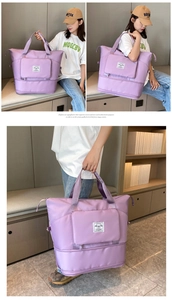 Detail of purple waterproof travel tote with reinforced handles and secure zip pocket