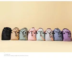 Travel bags displayed in eight vibrant colors with adjustable straps and durable fabric