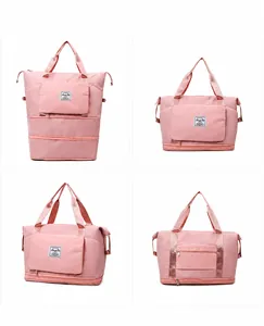 Pink waterproof travel duffel bag showing four expandable stages and reinforced handles
