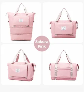 Detail view of pink large capacity travel bag showing expandable base and trolley sleeve