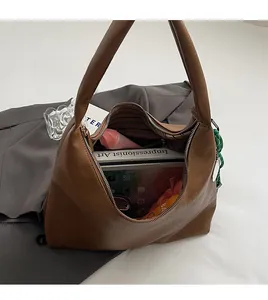 Detailed interior of the vintage brown tote bag showing large capacity for books