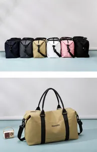 Detail view of large-capacity duffel bags in multiple colors with adjustable straps
