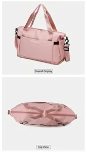 Macro view of pink travel bag showing reinforced handles and adjustable shoulder strap