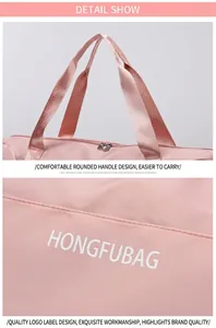 Detailed macro view of pink travel bag with woven handles and white brand logo