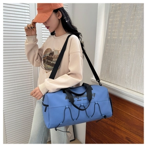 Blue waterproof sports bag with wet dry separation and shoe compartment side view